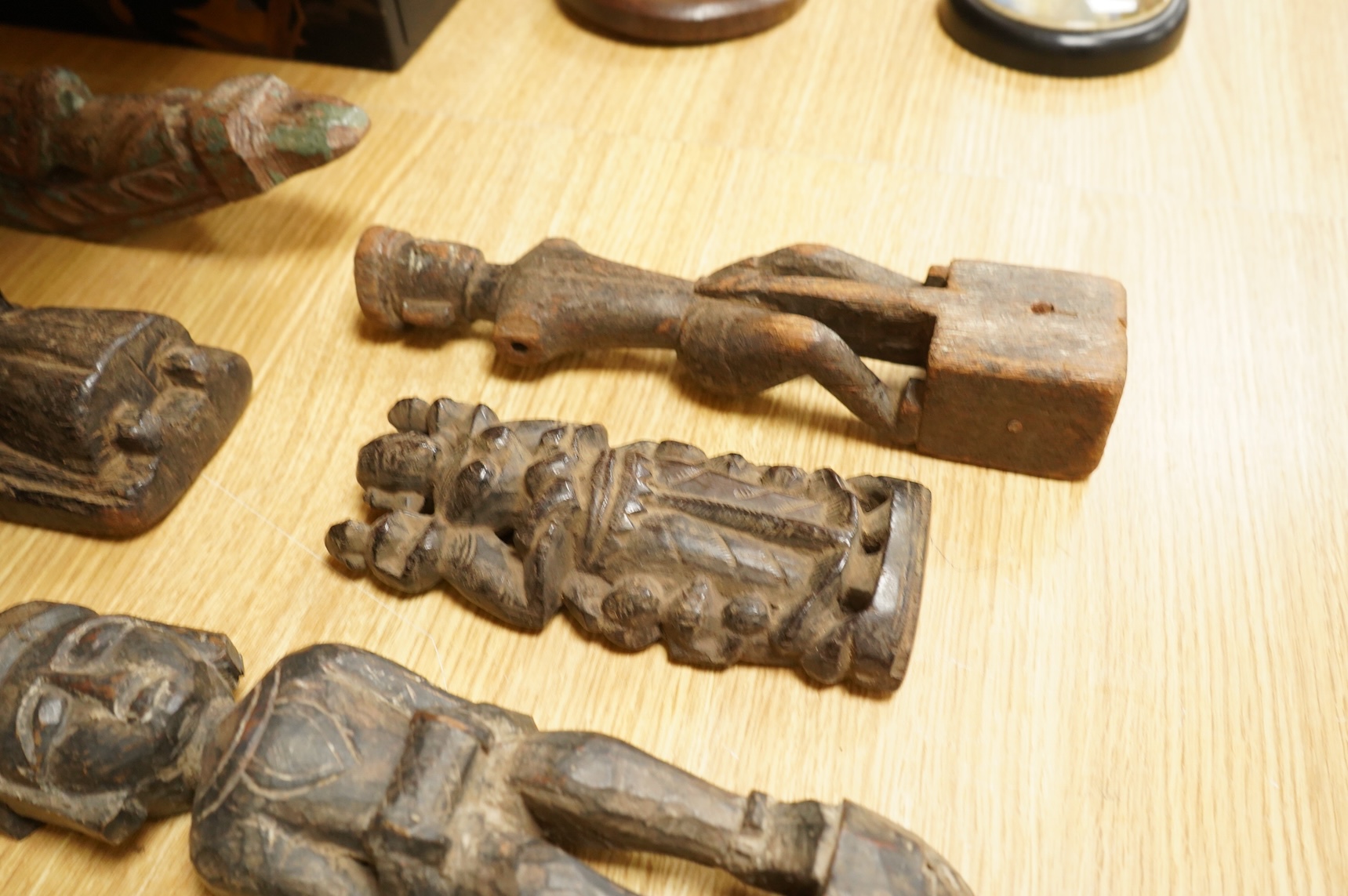 A group of Indian carved figures of deities, largest 42.5cm